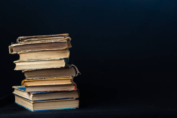istock Stack of hardcover old books with on a dark background. Bookshelf shop, Knowledge publications, literature. Bookish bookstore bookstore 1727376990