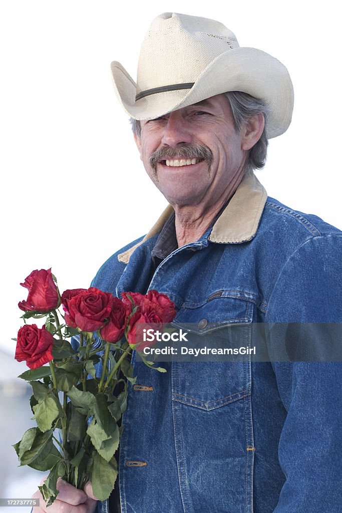 Cowboy con rosas - Foto de stock de 50-59 años libre de derechos