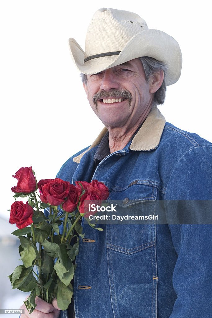 Cowboy con rose - Foto stock royalty-free di 60-69 anni