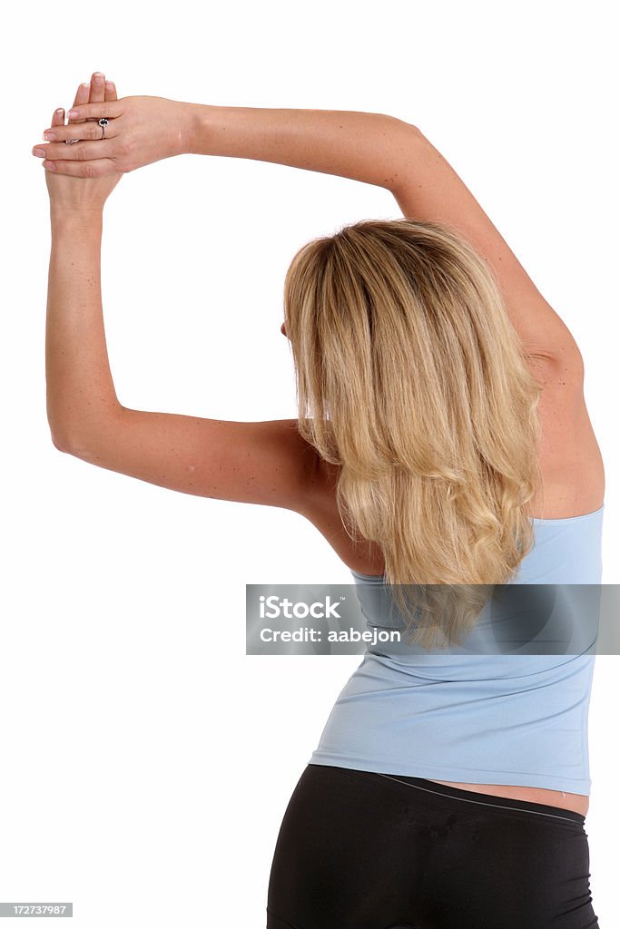Stretching Obliques Woman stretching her oblique muscles. Please view these all pictures of  this 20-24 Years Stock Photo