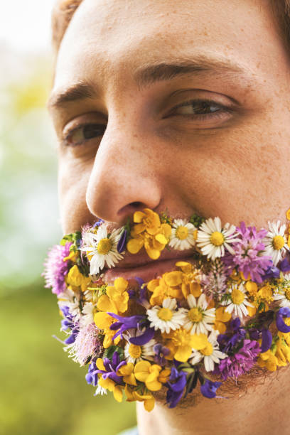 istock Man's petalled face tells of environmental reverence 1727384180