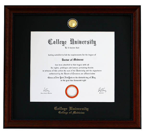 College Diploma "College medical degree diploma. University name, seal, location, date  and signature are fictitious and/or have been altered" medical student photos stock pictures, royalty-free photos & images
