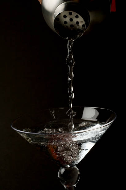 istock Martini glass with cocktail being poured into it 172739040