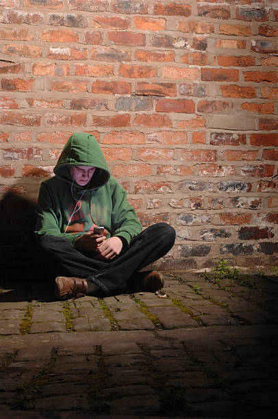 istock hoodie on the phone 172739384