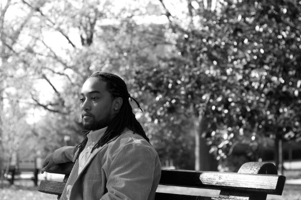 istock African-American male on park bench 172739579