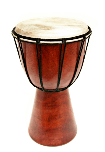 A nice red /brown wood hand drum isolated on a white background.