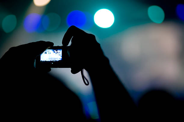 istock taking photo at concert 172740044