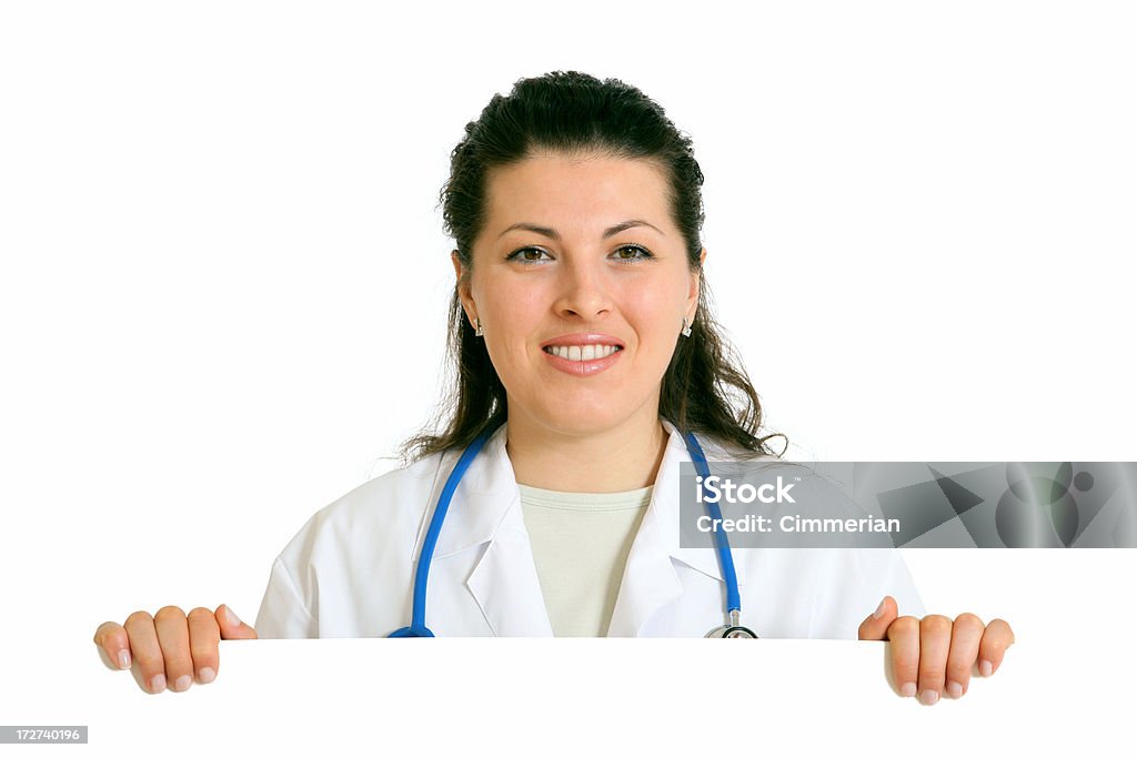 Женский доктор, держа пустой знак (на белом - Стоковые фото Белый роялти-фри