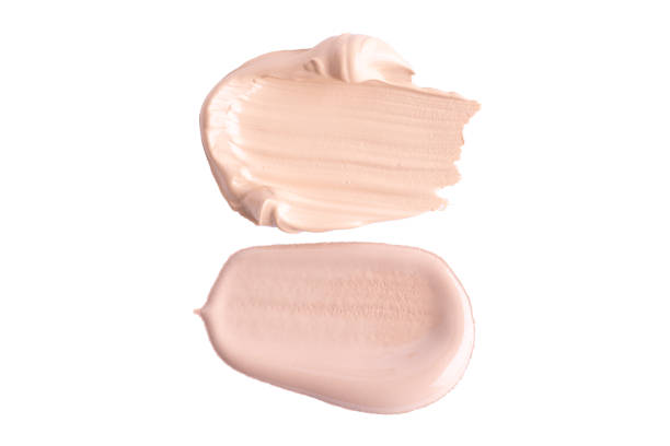 istock Liquid foundation strokes isolated on white background. Beige concealer smears set. BB, CC cream texture 1727402352