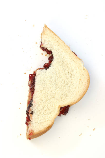 Peanut Butter & Jelly Sandwich Peanut butter and jelly sandwich with a bite taken out of it. peanut butter and jelly sandwich stock pictures, royalty-free photos & images