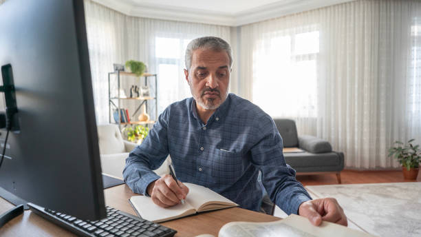 istock Adult man taking online language lessons at home 1727412825