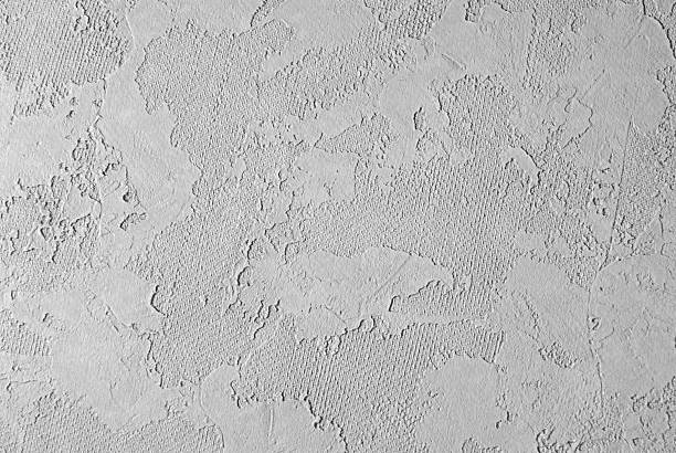 Rough Plaster A roughly textured plaster wallClick on the banner below to see more photos like this. painted drywall texture stock pictures, royalty-free photos & images