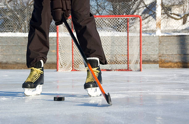 istock Hockey player with puck 172741464
