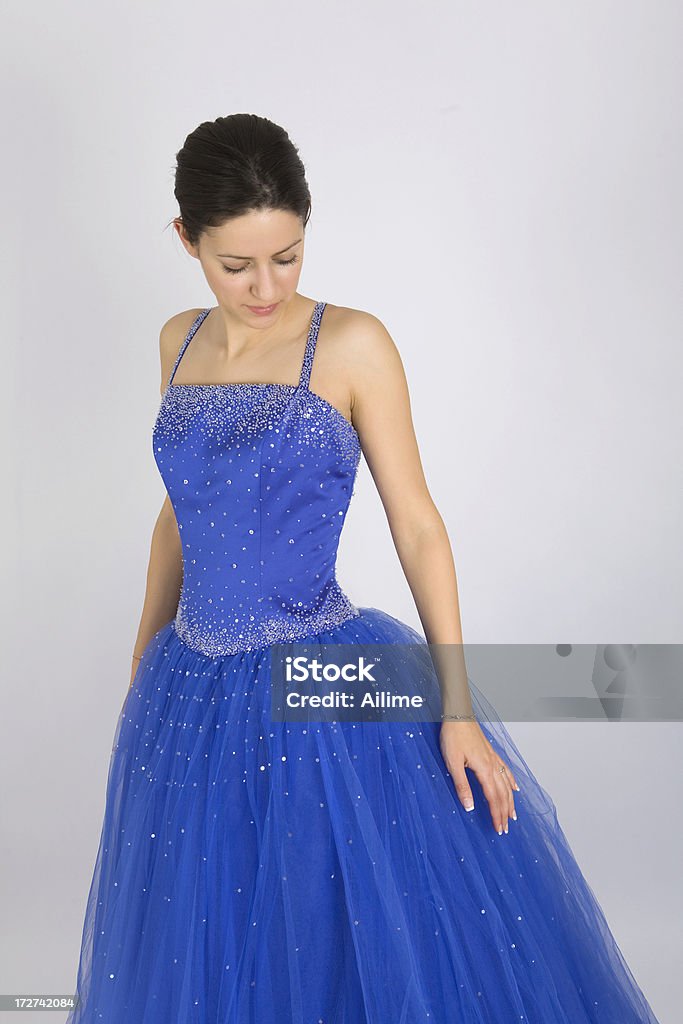 Lady in Blue Dress Beautiful young woman ready for the prom night wearing her blue evening gown Adult Stock Photo