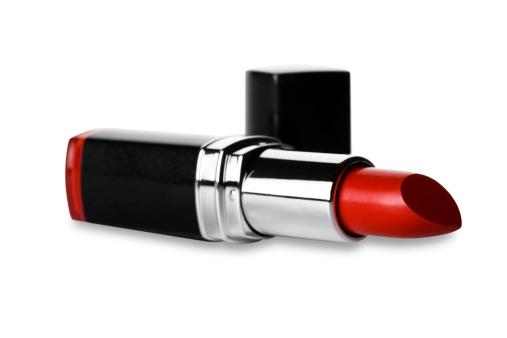 Red lipstick lying on the side.