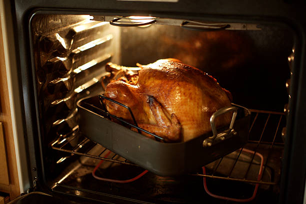 istock Full turkey coming out of the oven cooked 172743018