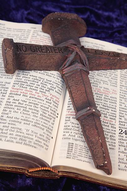 istock Religious: Jesus' Crucifixion Luke 23 Bible scripture with nail cross 172743195