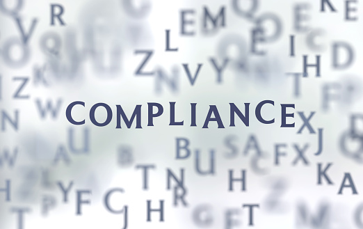 The word Compliance appearing between the letters. Communication concept.