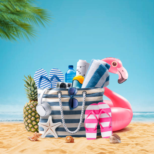 istock Beach bag and accessories on a tropical beach 1727434138