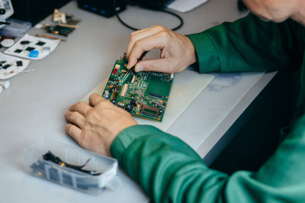 istock Electrician repairing an electrical circuit board at workshop 1727438773