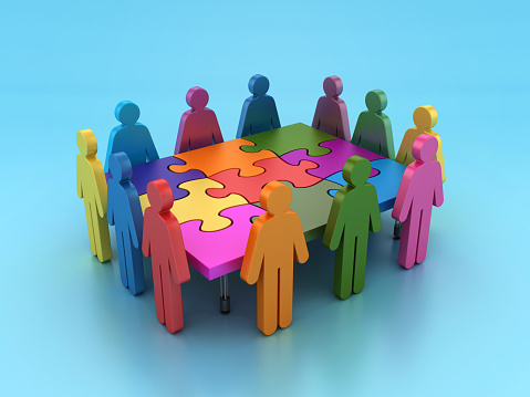 3D illustration of people connecting together puzzle elements. Business teamwork and collaboration, partnership, cooperation and development concept. Multicultural team, unity in diversity.