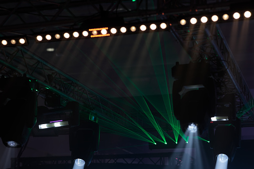 Stage lighting equipment at indoor live event. Selective focus.