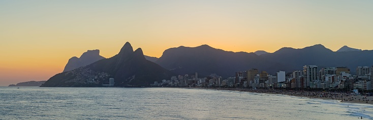A stunning panoramic view of the shoreline of Rio de Janeiro, Brazil during a beautiful sunset