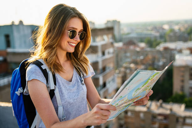 istock Young woman, student traveler with backpack enjoying summer vacation. 1727440986