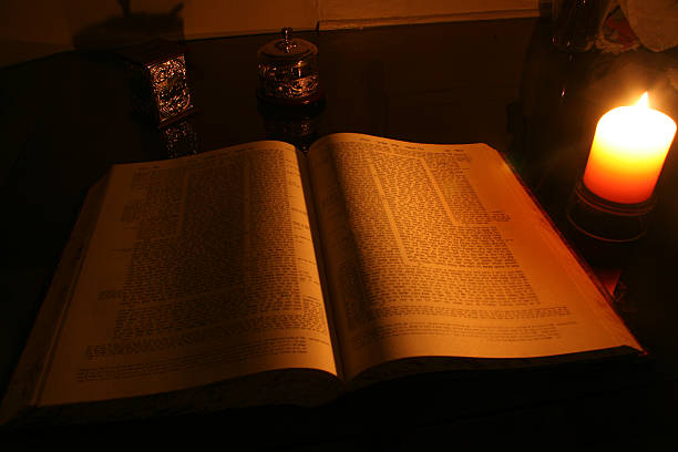 Talmud at candle light stock photo