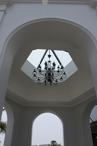 The hanging lamps decorate the roof of the building's pavilion so beautifully