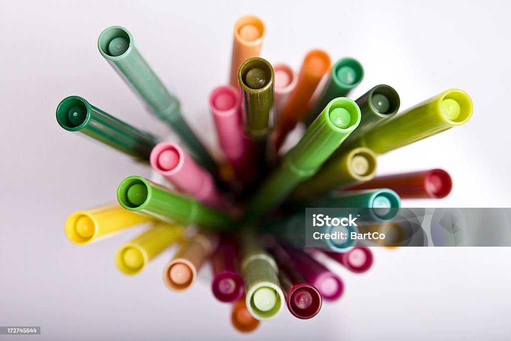 Felt tips in many colours This is a glass of felt tips in warm and green colours Felt Tip Pen Stock Photo