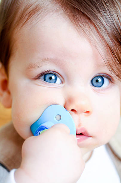 istock Cute baby with pacifier in mouth 172745833