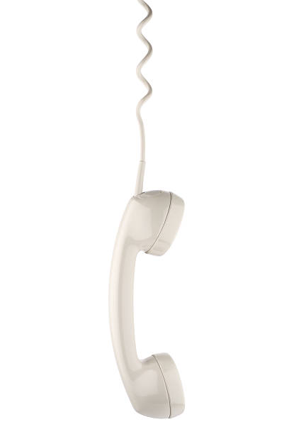 istock White phone handset hanging on cord 172745909