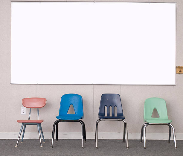 istock Four chairs and a white erase board in  school 172746448