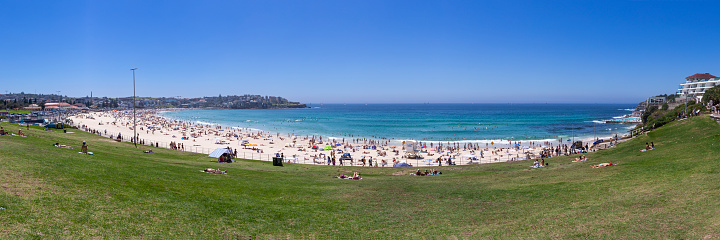 Bondi Beach has been a popular tourist destination for over a century and attracts millions of visitors each year for its soft golden sand, clear blue waters, and nearby cafes, restaurants and shops.