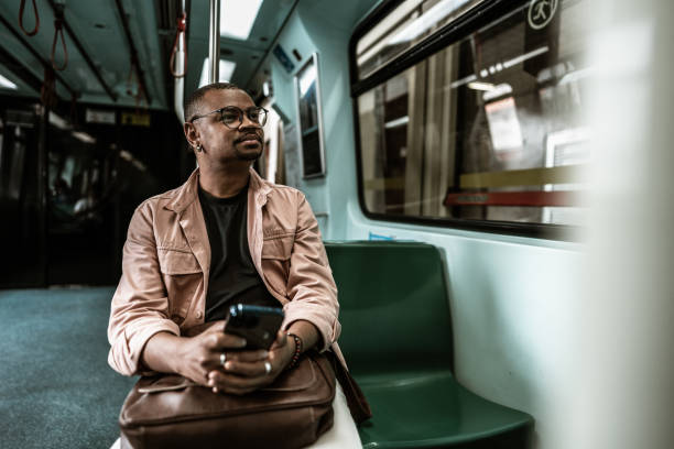 istock Mid adult man looking through window in railroad car 1727472921