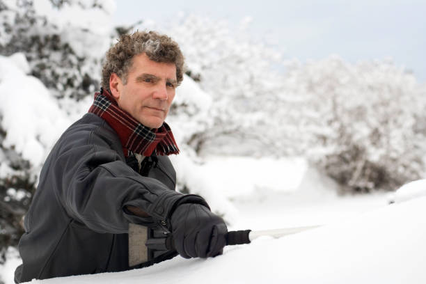 istock Brushing Snow Off the Car 172748050
