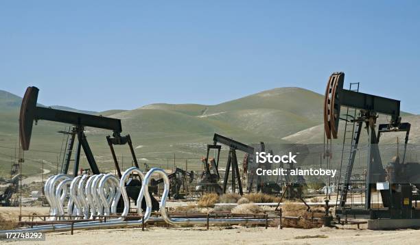 Oilfield In California With Multiple Wellhead Pumps Stock Photo - Download Image Now