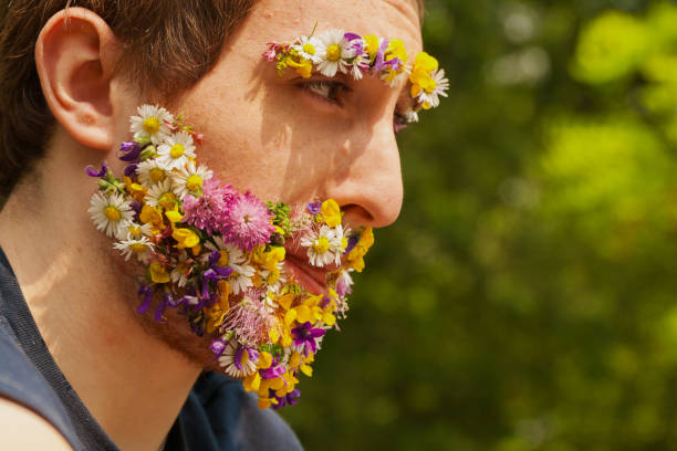 istock Vibrant blooms as beard; man's eco-consciousness evident 1727489971