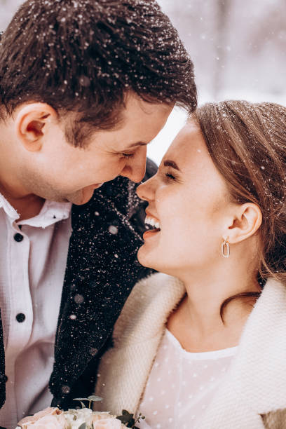 istock Winter wedding. Newlyweds walking outdoors at winter time 1727500639