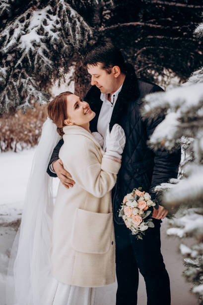 istock Winter wedding. Newlyweds walking outdoors at winter time 1727500644