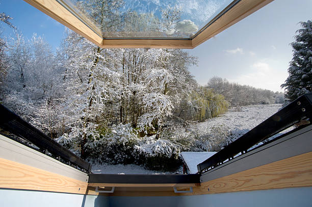 snow A snow covered rural landscape in the countryside viewed from an open loft window wintry landscape january december landscape stock pictures, royalty-free photos & images