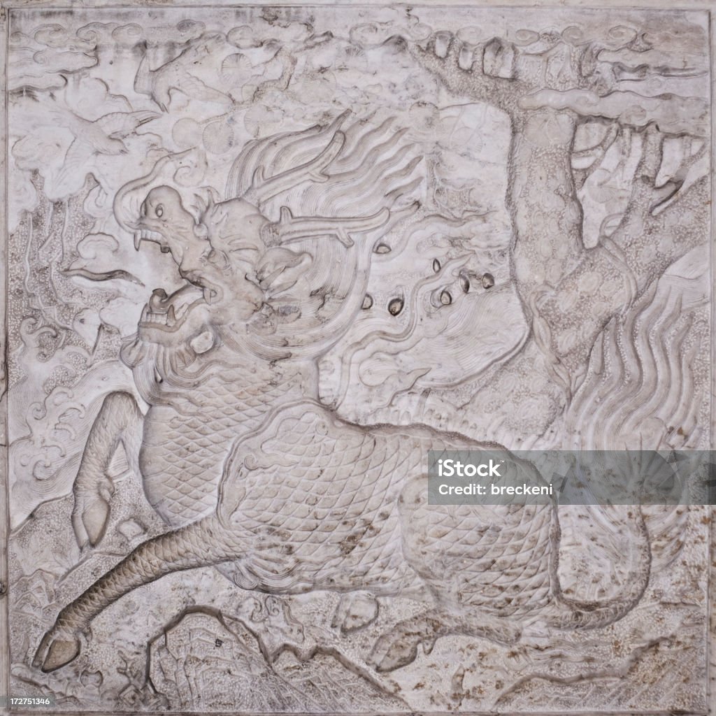 Qilin - facing left A carved limestone panel from the gate to the tomb of Zu Dashou and his sons c1660-1700. Qing dynasty.  It shows the mythical creature aqilinai 17th Century Stock Photo