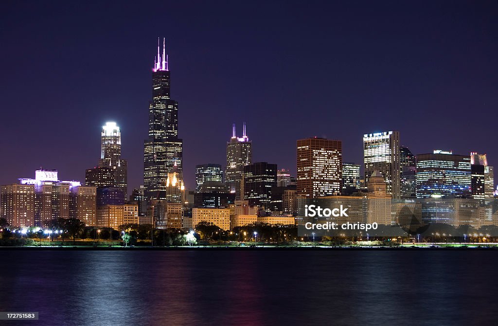 Chicago loop skyline next to the water The south half of Chicago's Loop at night, as seen from across Lake Michigan. Chicago - Illinois Stock Photo