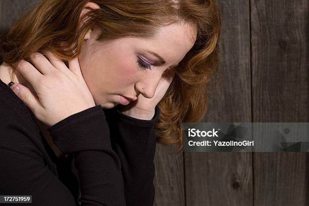 Young Woman Looking Down With Sad Expression Stock Photo - Download Image Now - 16-17 Years, Adult, Anxiety
