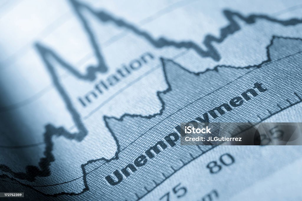 Folded sheet of paper with an unemployment graph on Business graph unemployment and inflation in newspapers Unemployment Stock Photo