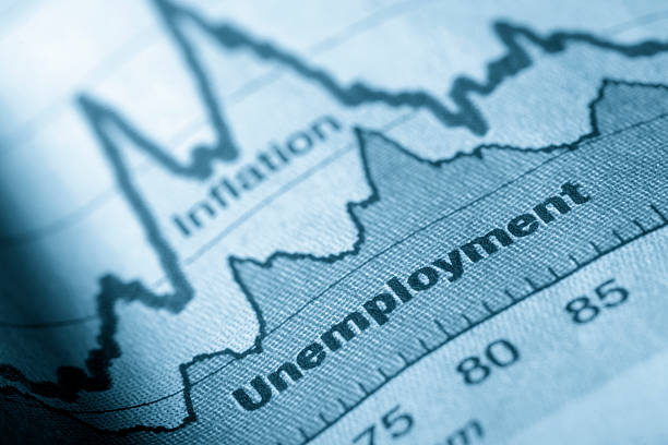 Folded sheet of paper with an unemployment graph on Business graph unemployment and inflation in newspapers inflation economics photos stock pictures, royalty-free photos & images