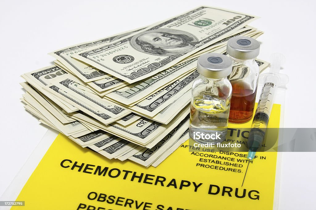 Cost of chemotherapy Actual hundred dollar bills and drug vials + syringe on top of a chemotherapy transport bag.  White background.  Please visit my lightbox for more similar photos Expense Stock Photo