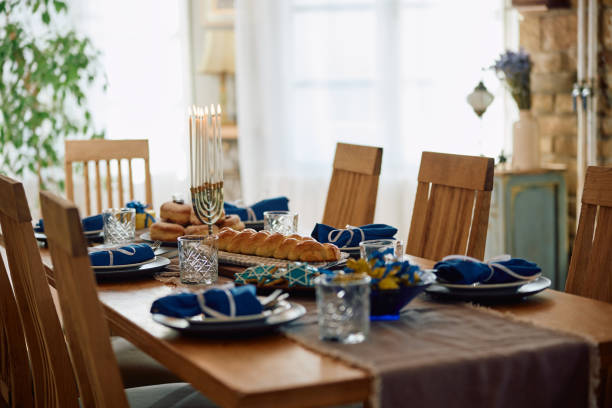 istock Hanukkah table setting ready for family meal at home. 1727532048