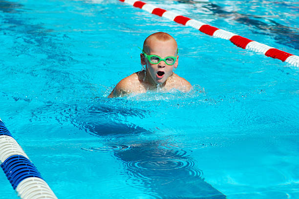 istock Young boy swimming butterfly stroke 172753463